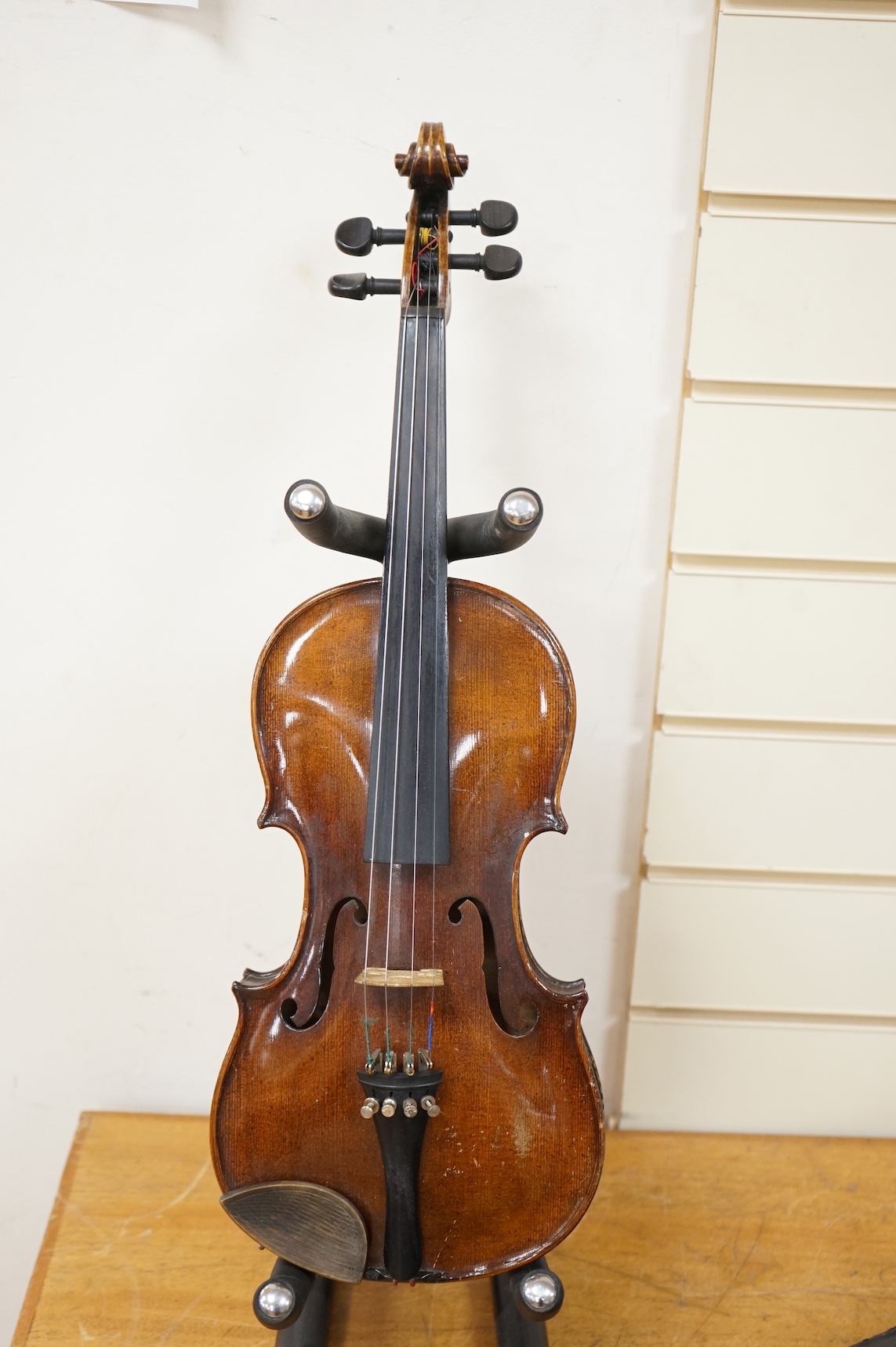 A late 19th century violin, with label for J.B. Schweitzer, 7/8 size, no bow, in case